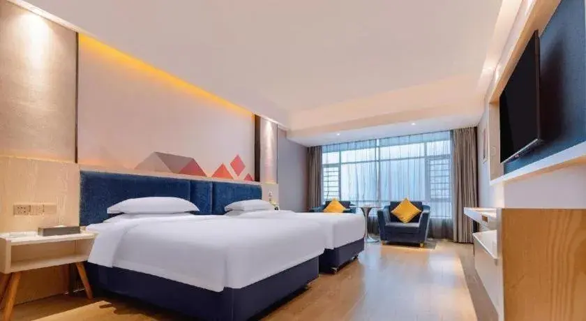 Bed in Borrman Hotel Liuzhou High-Speed Railway Station Bed in Borrman Hotel Liuzhou High-Speed Railway Station