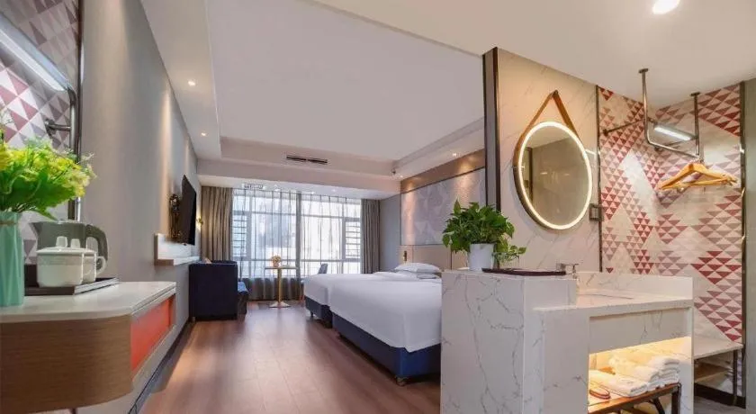 Bed in Borrman Hotel Liuzhou High-Speed Railway Station