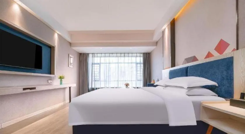 Bed in Borrman Hotel Liuzhou High-Speed Railway Station