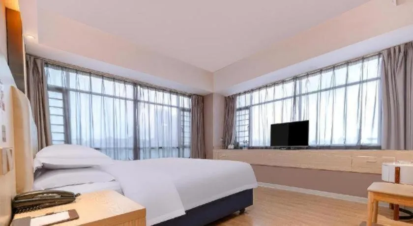 Bed in Borrman Hotel Liuzhou High-Speed Railway Station