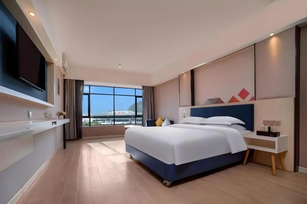 Bed in Borrman Hotel Liuzhou High-Speed Railway Station