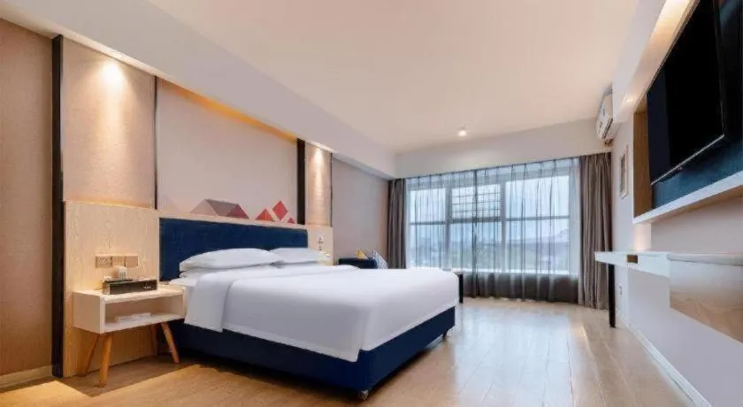 Bed in Borrman Hotel Liuzhou High-Speed Railway Station