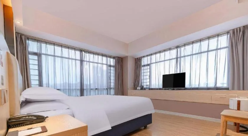 Bed in Borrman Hotel Liuzhou High-Speed Railway Station