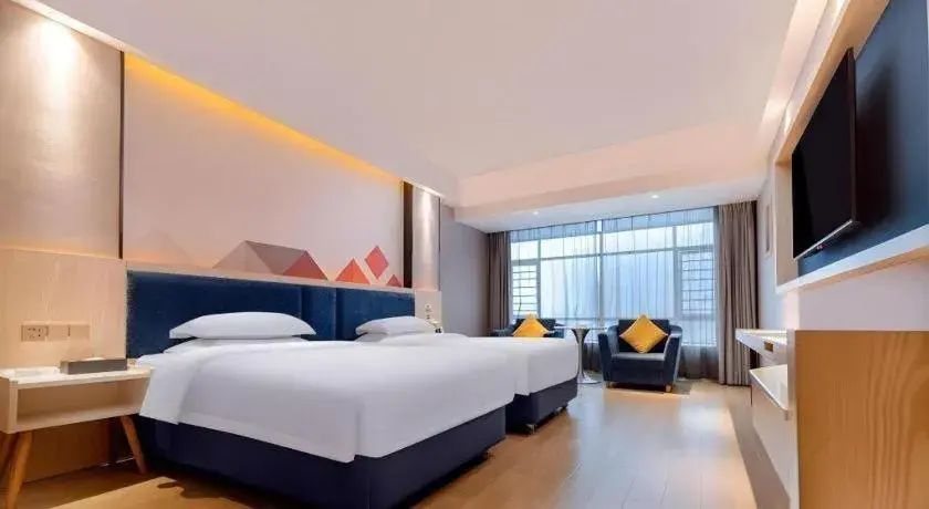 Bed in Borrman Hotel Liuzhou High-Speed Railway Station Bed in Borrman Hotel Liuzhou High-Speed Railway Station