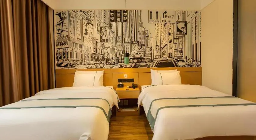 Bed in City Comfort Inn Shaoguan Biguiyuan Phoenix City Gold Village