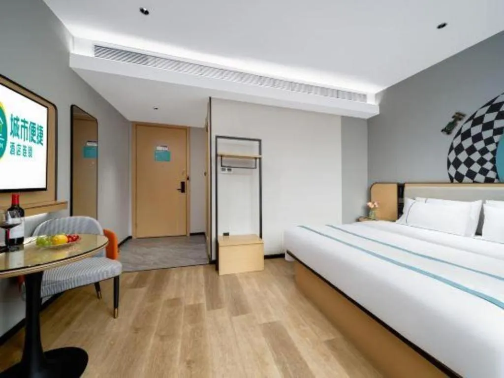 Bed in City Comfort Inn Shaoguan Biguiyuan Phoenix City Gold Village