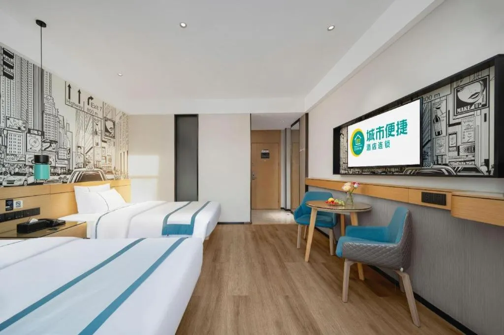 Bed in City Comfort Inn Shaoguan Biguiyuan Phoenix City Gold Village