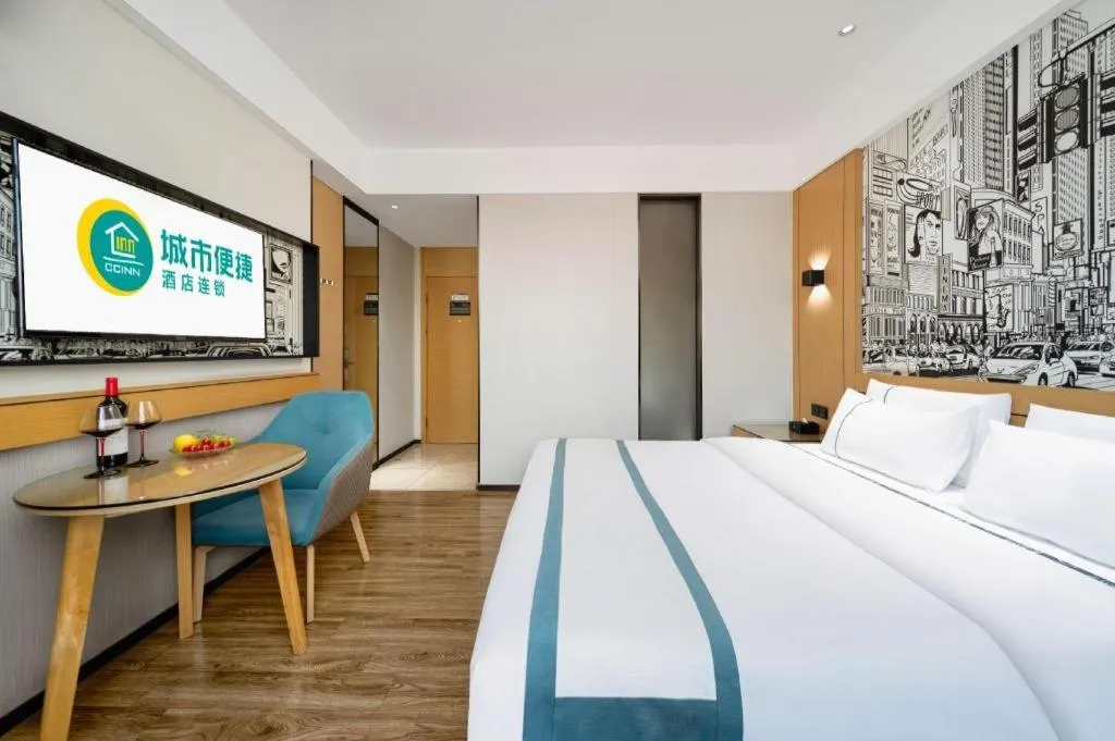 Bed in City Comfort Inn Shaoguan Biguiyuan Phoenix City Gold Village