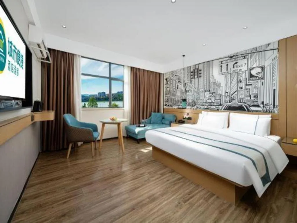 Bed in City Comfort Inn Shaoguan Biguiyuan Phoenix City Gold Village