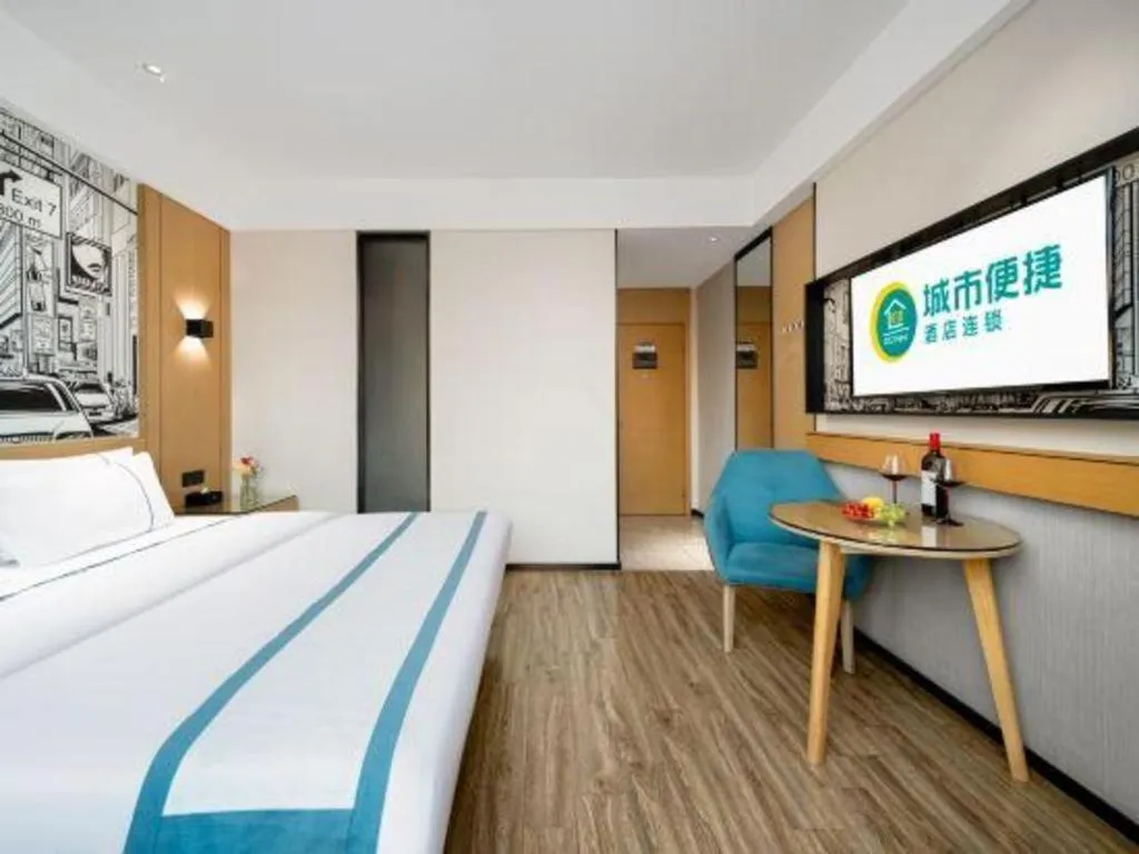 Bed in City Comfort Inn Shaoguan Biguiyuan Phoenix City Gold Village