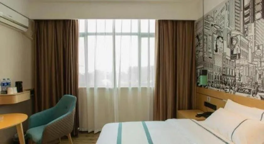 Bed in City Comfort Inn Shaoguan Biguiyuan Phoenix City Gold Village