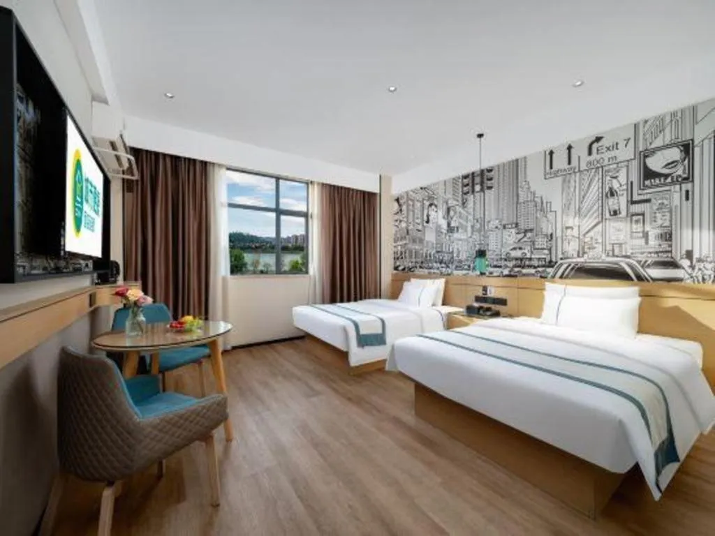 Bed in City Comfort Inn Shaoguan Biguiyuan Phoenix City Gold Village