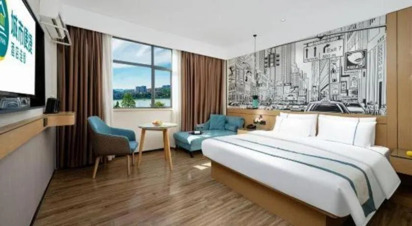 Bed in City Comfort Inn Shaoguan Biguiyuan Phoenix City Gold Village