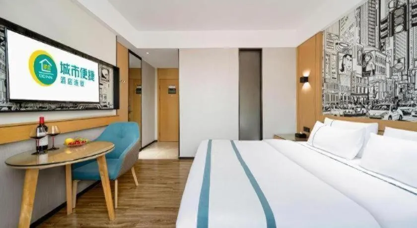 Bed in City Comfort Inn Shaoguan Biguiyuan Phoenix City Gold Village