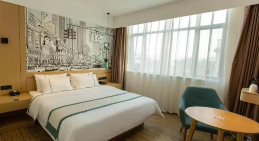 Bed in City Comfort Inn Shaoguan Biguiyuan Phoenix City Gold Village