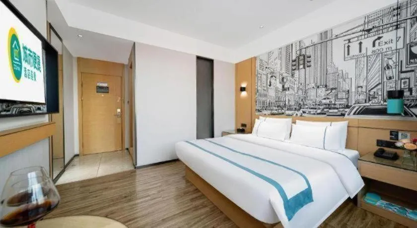 Bed in City Comfort Inn Shaoguan Biguiyuan Phoenix City Gold Village