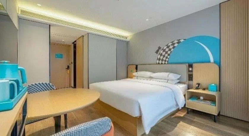 Bed in City Comfort Inn Shaoguan Biguiyuan Phoenix City Gold Village