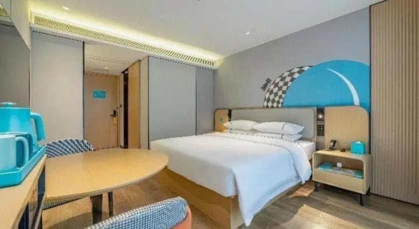 Bed in City Comfort Inn Shaoguan Biguiyuan Phoenix City Gold Village
