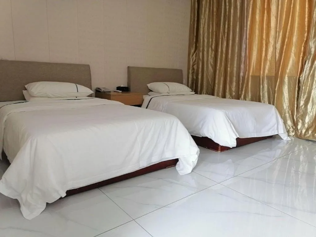 Bed in City Comfort Inn Shaoguan Biguiyuan Phoenix City Gold Village