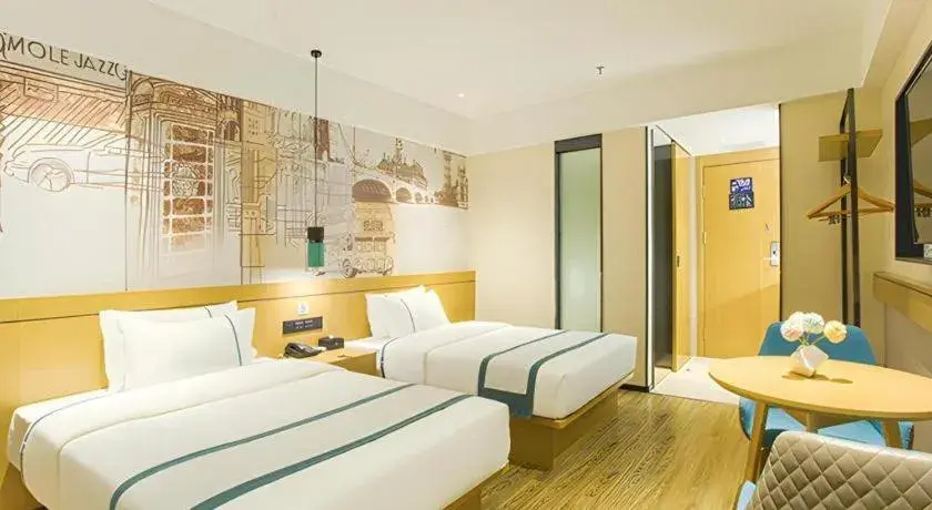 Bed in City Comfort Inn Wuzhou Sun Plaza Wanda Bed in City Comfort Inn Wuzhou Sun Plaza Wanda