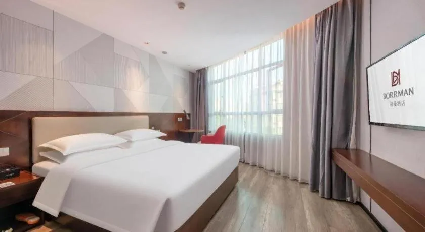 Bed in Borrman Hotel Yunfu Xinxing County Bus Station