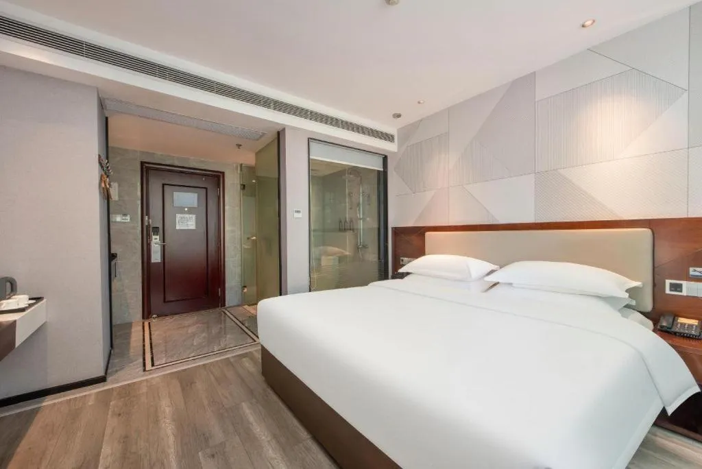 Bed in Borrman Hotel Yunfu Xinxing County Bus Station