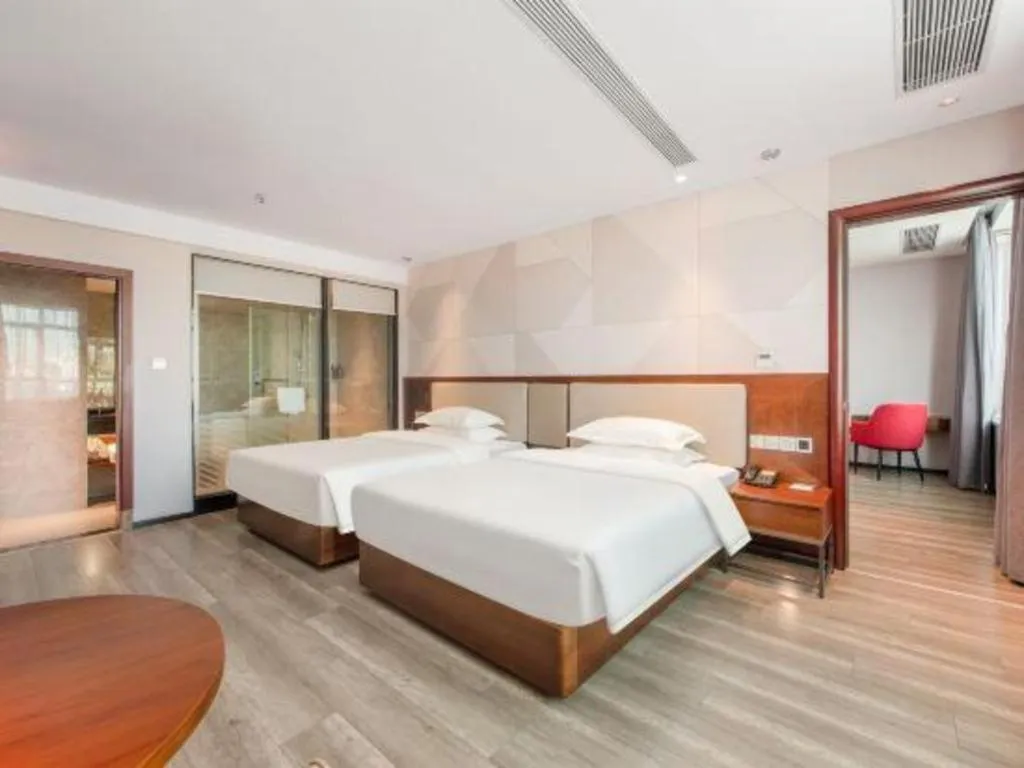 Bed in Borrman Hotel Yunfu Xinxing County Bus Station