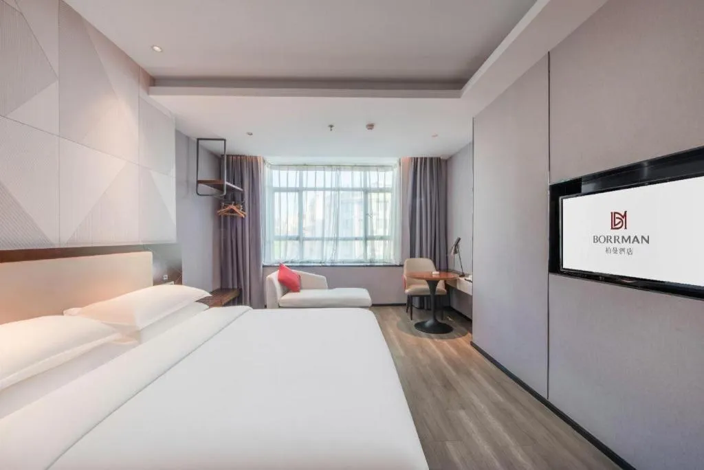 Bed in Borrman Hotel Yunfu Xinxing County Bus Station