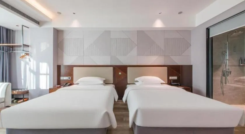 Bed in Borrman Hotel Yunfu Xinxing County Bus Station