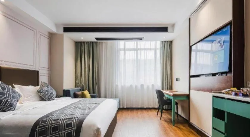 Bed in GEM Hotel Changzhou Xuejia'aoyuan North High-Speed Railway Station