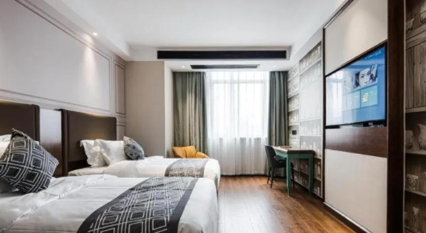 Bed in GEM Hotel Changzhou Xuejia'aoyuan North High-Speed Railway Station