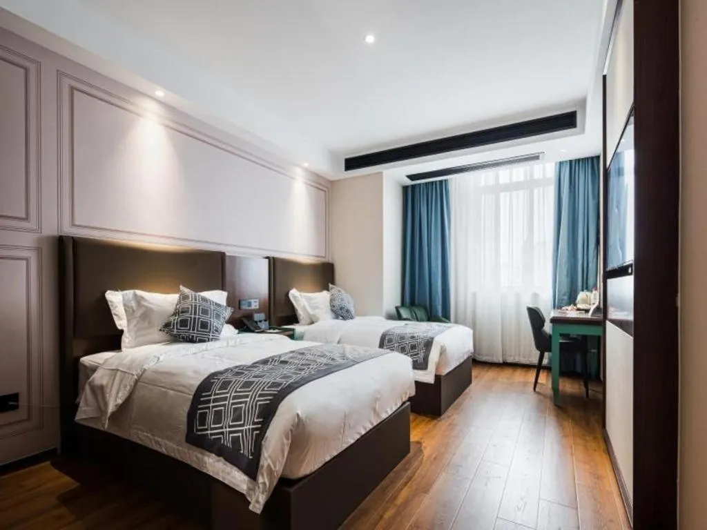 Bed in GEM Hotel Changzhou Xuejia'aoyuan North High-Speed Railway Station