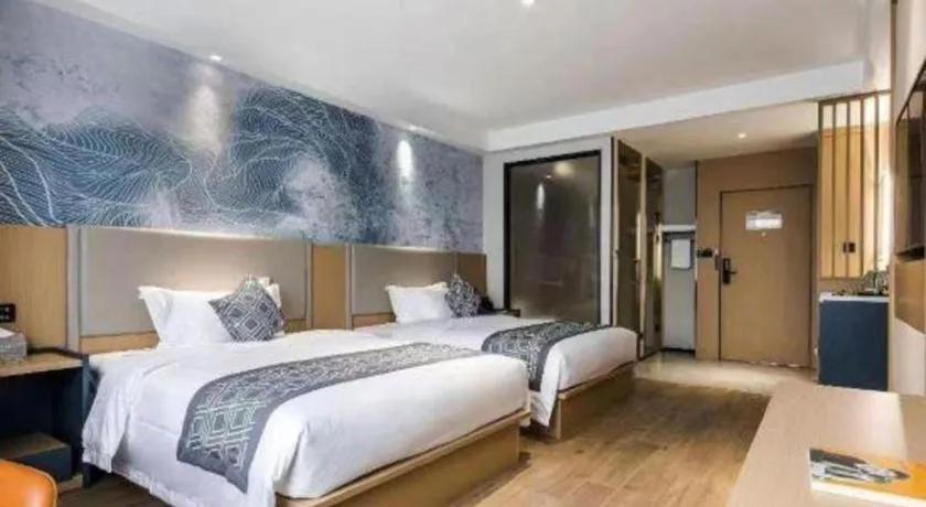 Bed in GEM Hotel Changzhou Xuejia'aoyuan North High-Speed Railway Station