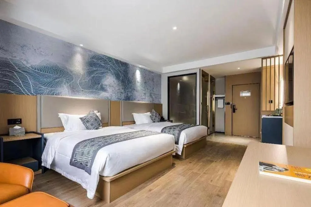 Bed in GEM Hotel Changzhou Xuejia'aoyuan North High-Speed Railway Station