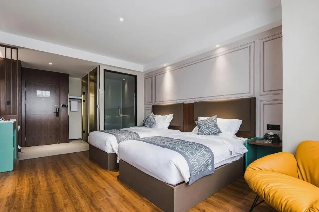 Bed in GEM Hotel Changzhou Xuejia'aoyuan North High-Speed Railway Station