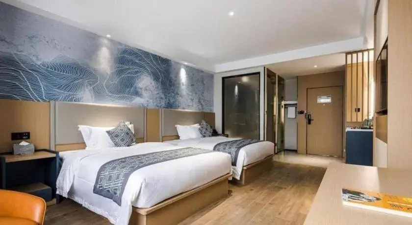 Bed in GEM Hotel Changzhou Xuejia'aoyuan North High-Speed Railway Station Bed in GEM Hotel Changzhou Xuejia'aoyuan North High-Speed Railway Station