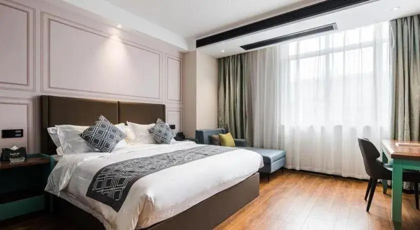 Bed in GEM Hotel Changzhou Xuejia'aoyuan North High-Speed Railway Station Bed in GEM Hotel Changzhou Xuejia'aoyuan North High-Speed Railway Station