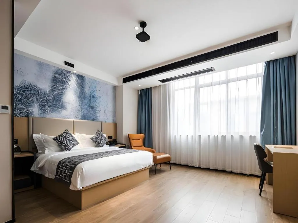 Bed in GEM Hotel Changzhou Xuejia'aoyuan North High-Speed Railway Station