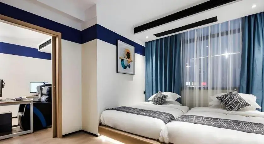 Bed in GEM Hotel Changzhou Xuejia'aoyuan North High-Speed Railway Station Bed in GEM Hotel Changzhou Xuejia'aoyuan North High-Speed Railway Station