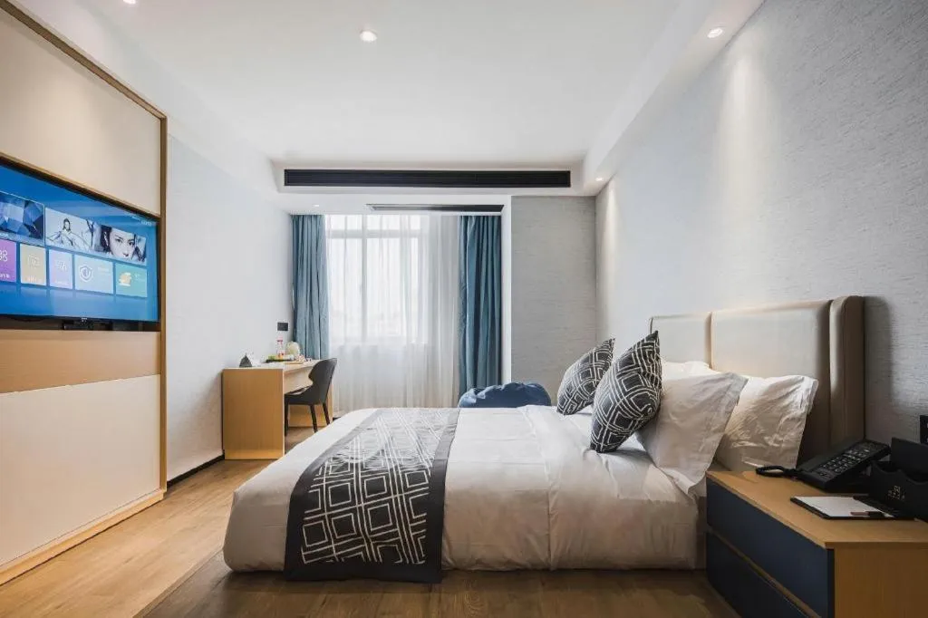 Bed in GEM Hotel Changzhou Xuejia'aoyuan North High-Speed Railway Station