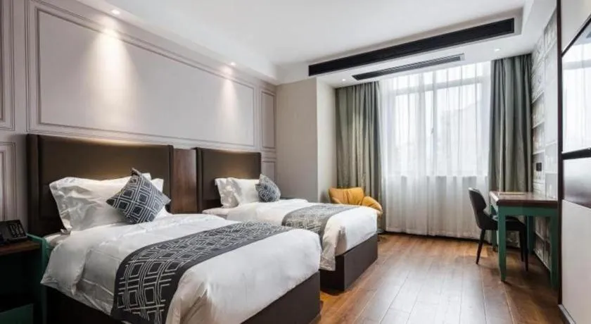 Bed in GEM Hotel Changzhou Xuejia'aoyuan North High-Speed Railway Station