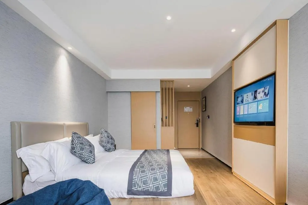 Bed in GEM Hotel Changzhou Xuejia'aoyuan North High-Speed Railway Station