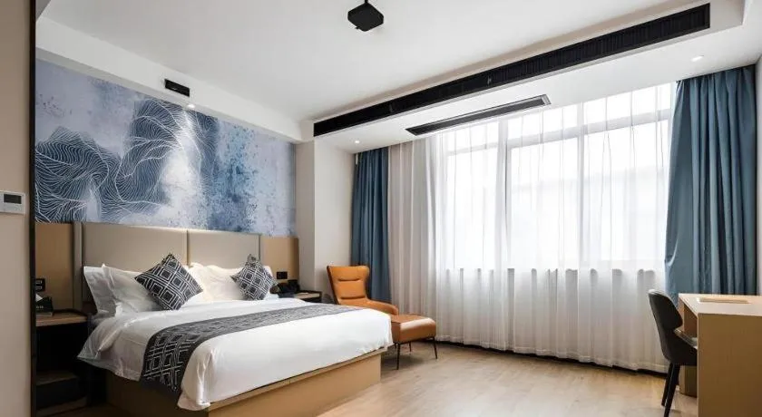 Bed in GEM Hotel Changzhou Xuejia'aoyuan North High-Speed Railway Station