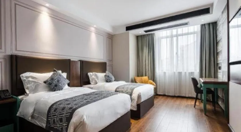 Bed in GEM Hotel Changzhou Xuejia'aoyuan North High-Speed Railway Station