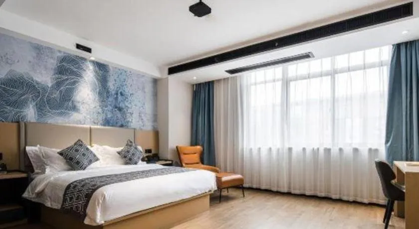 Bed in GEM Hotel Changzhou Xuejia'aoyuan North High-Speed Railway Station