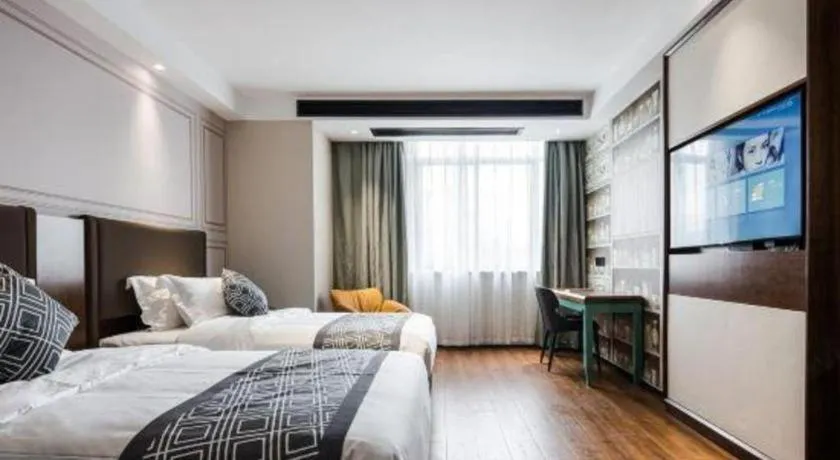 Bed in GEM Hotel Changzhou Xuejia'aoyuan North High-Speed Railway Station