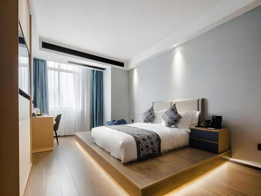 Bed in GEM Hotel Changzhou Xuejia'aoyuan North High-Speed Railway Station