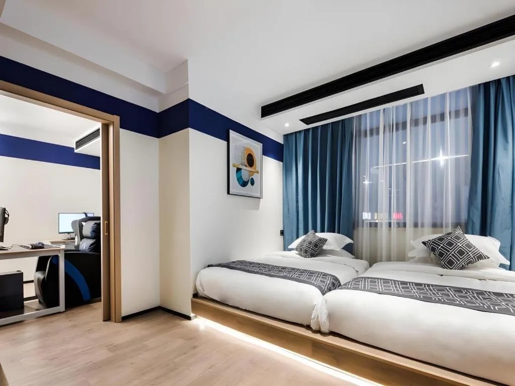 Bed in GEM Hotel Changzhou Xuejia'aoyuan North High-Speed Railway Station