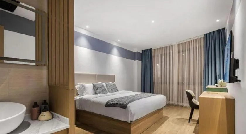 Bed in GEM Hotel Changzhou Xuejia'aoyuan North High-Speed Railway Station