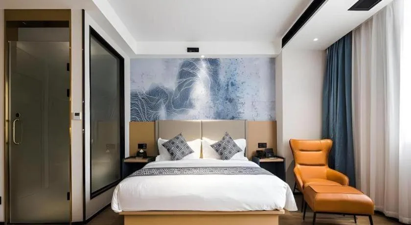 Bed in GEM Hotel Changzhou Xuejia'aoyuan North High-Speed Railway Station